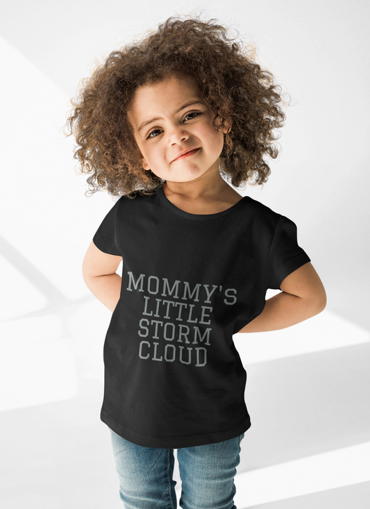 Toddler wearing "Mommy's Little Storm Cloud" short sleeve tee, black color.
