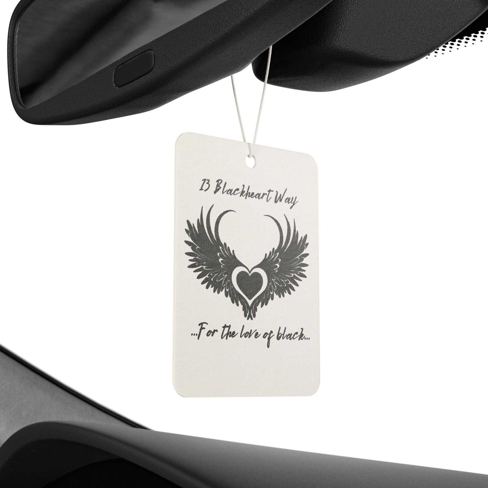 Car air freshener with 13 Blackheart Way logo hanging in vehicle interior.