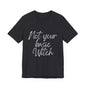 Witch printed tee shirt with "Not Your Basic Witch" design in black.