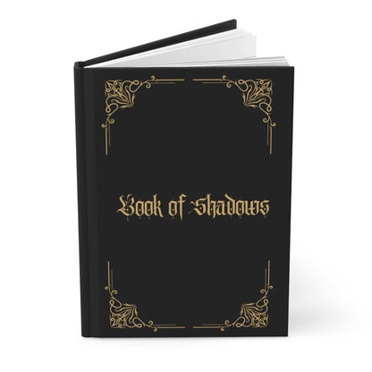 Book of Shadows hardcover journal with elegant black and gold design.