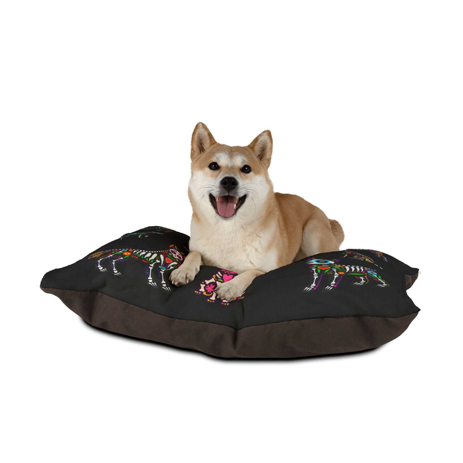 Dog bed with colorful sugar skull design, perfect for Dia de los Muertos or Halloween, machine washable.