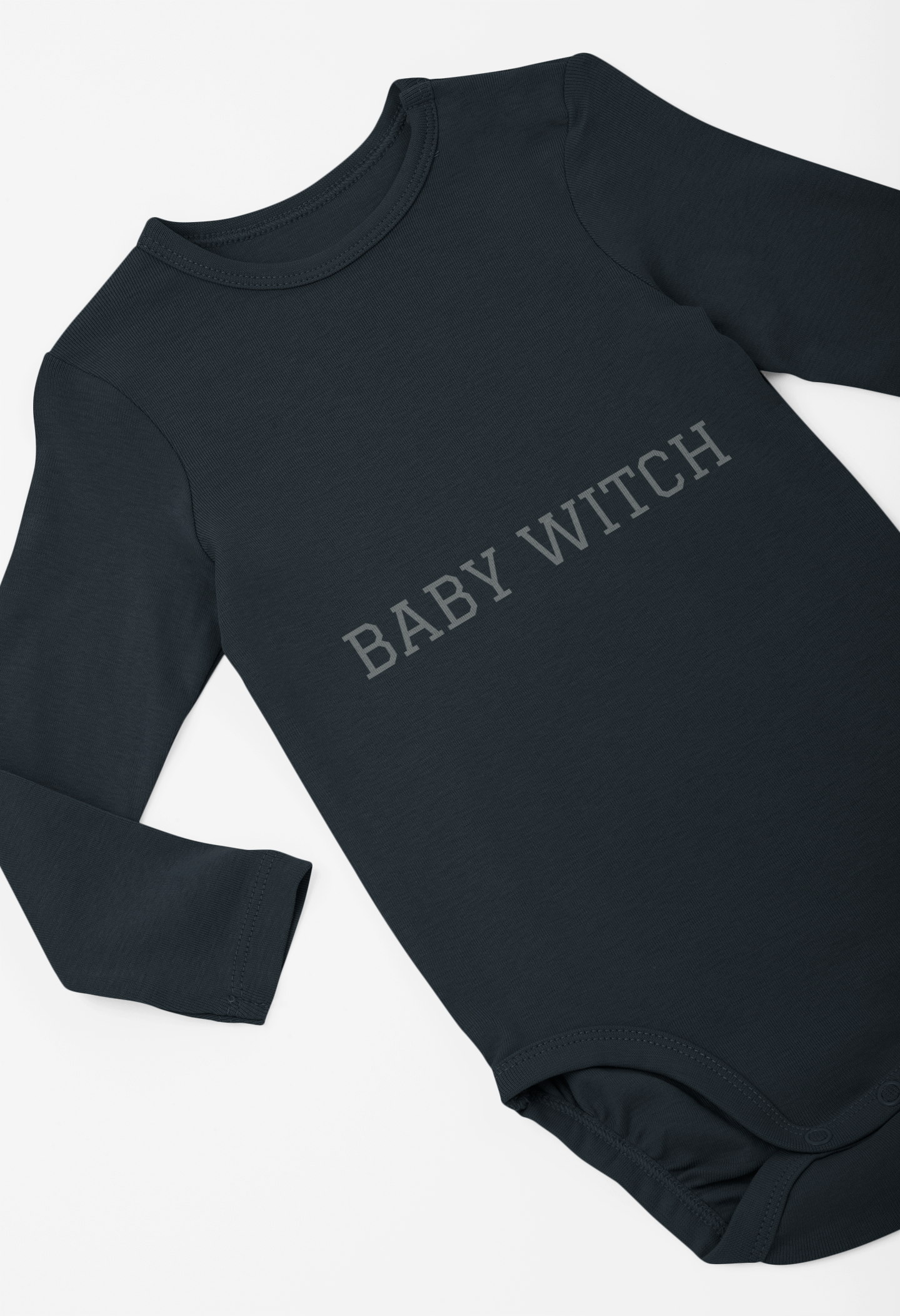 Baby Witch Infant long sleeve bodysuit in soft fabric, durable and easy to change, with plastic snap closures.