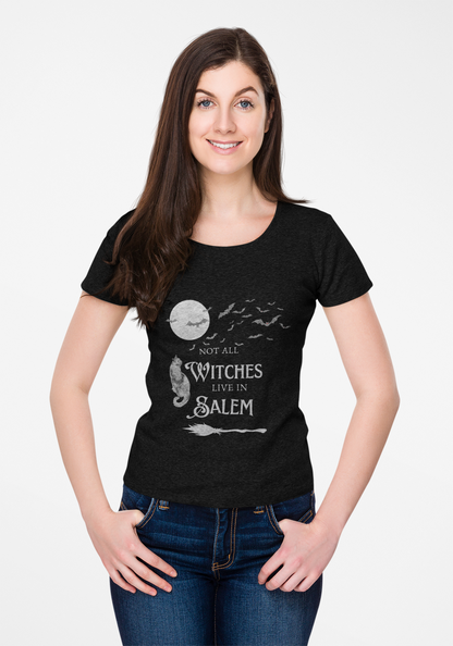 Woman wearing black "Not All Witches Live in Salem" t-shirt with moon and bats design