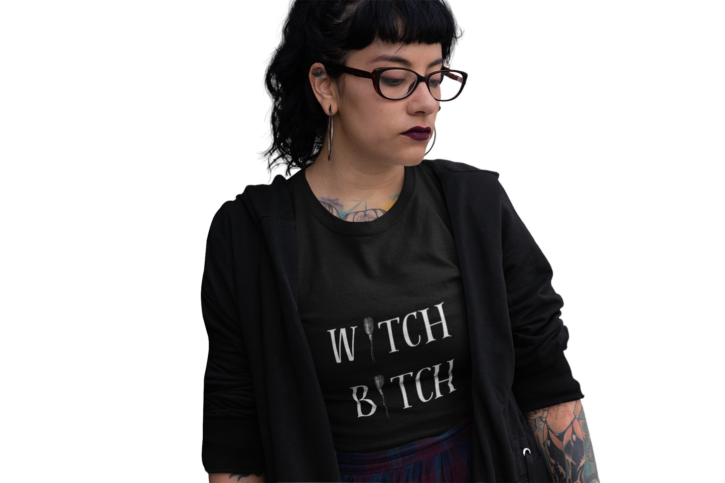 Woman wearing black W*tch B*tch unisex jersey short sleeve tee with white text and broom graphic.