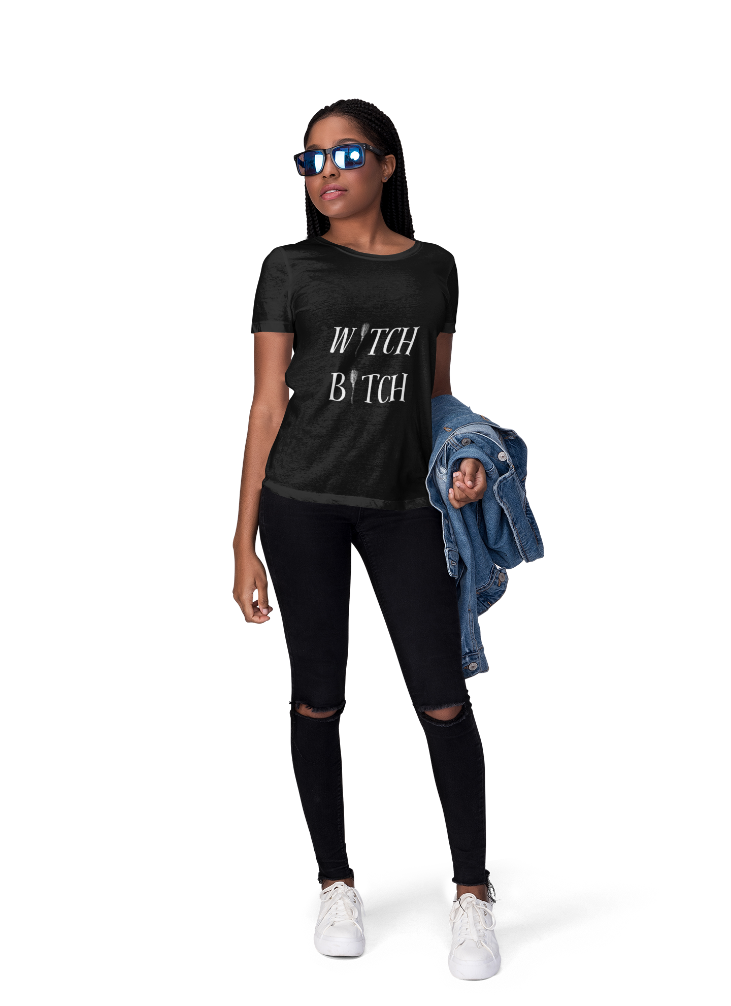 Woman wearing black Witch Bitch unisex jersey short sleeve tee with sunglasses and holding a denim jacket