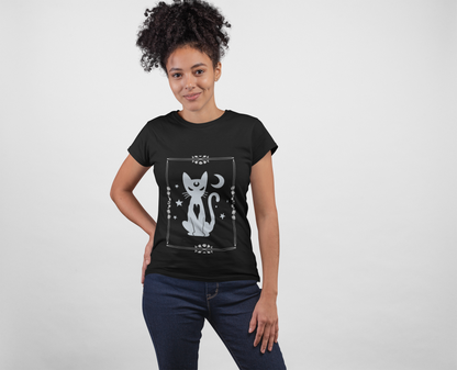 Black unisex t-shirt featuring a mystical white witchy cat design with stars and crescent moon, worn by a woman.