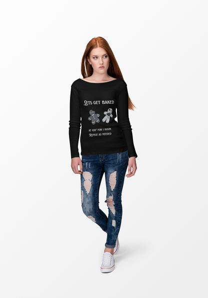 Woman wearing black Lets Get Baked Long Sleeve Tee with gingerbread design and text, paired with ripped blue jeans and white sneakers