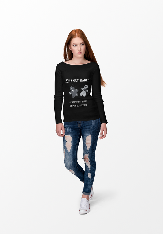 Woman wearing black Lets Get Baked Long Sleeve Tee with gingerbread design and text, paired with ripped blue jeans and white sneakers