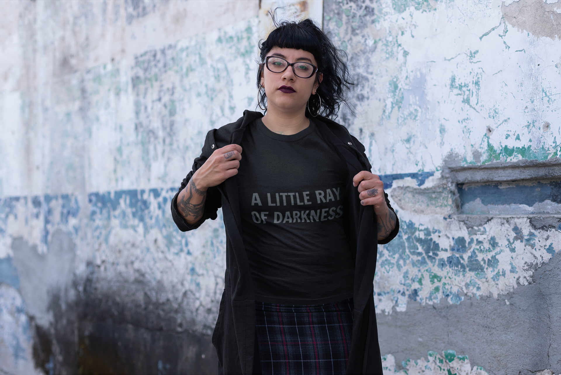 Black t-shirt with "A Little Ray of Darkness" gothic font slogan, perfect for moody, dark fashion style