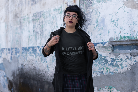 Black t-shirt with "A Little Ray of Darkness" gothic font slogan, perfect for moody, dark fashion style