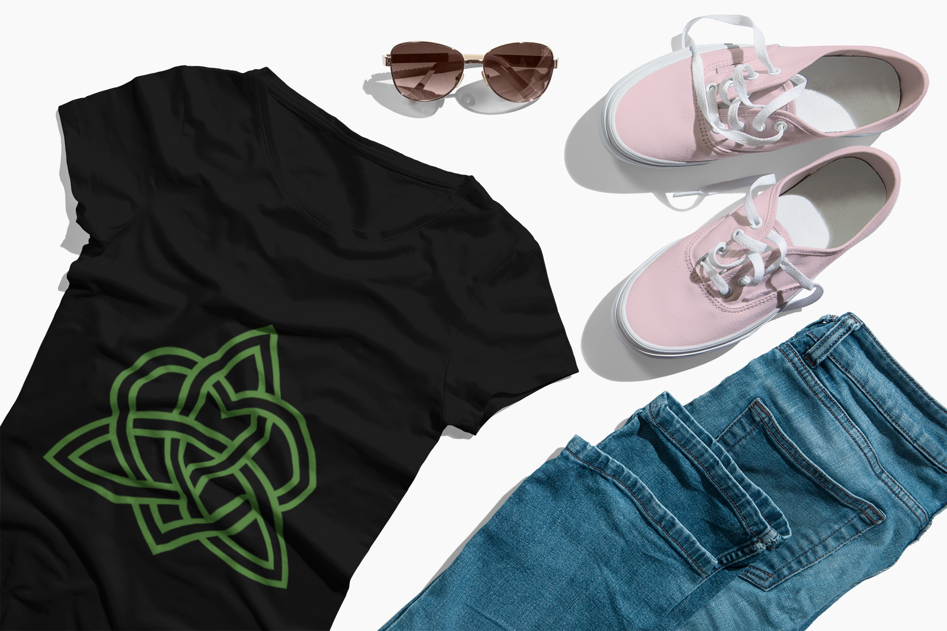 Black t-shirt featuring hand-drawn Celtic Trinity Knot intertwined with a heart symbol.
