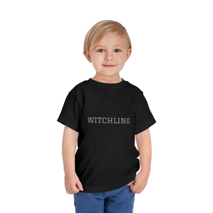 Witchling Toddler Short Sleeve Tee in black, 100% cotton, worn by child.