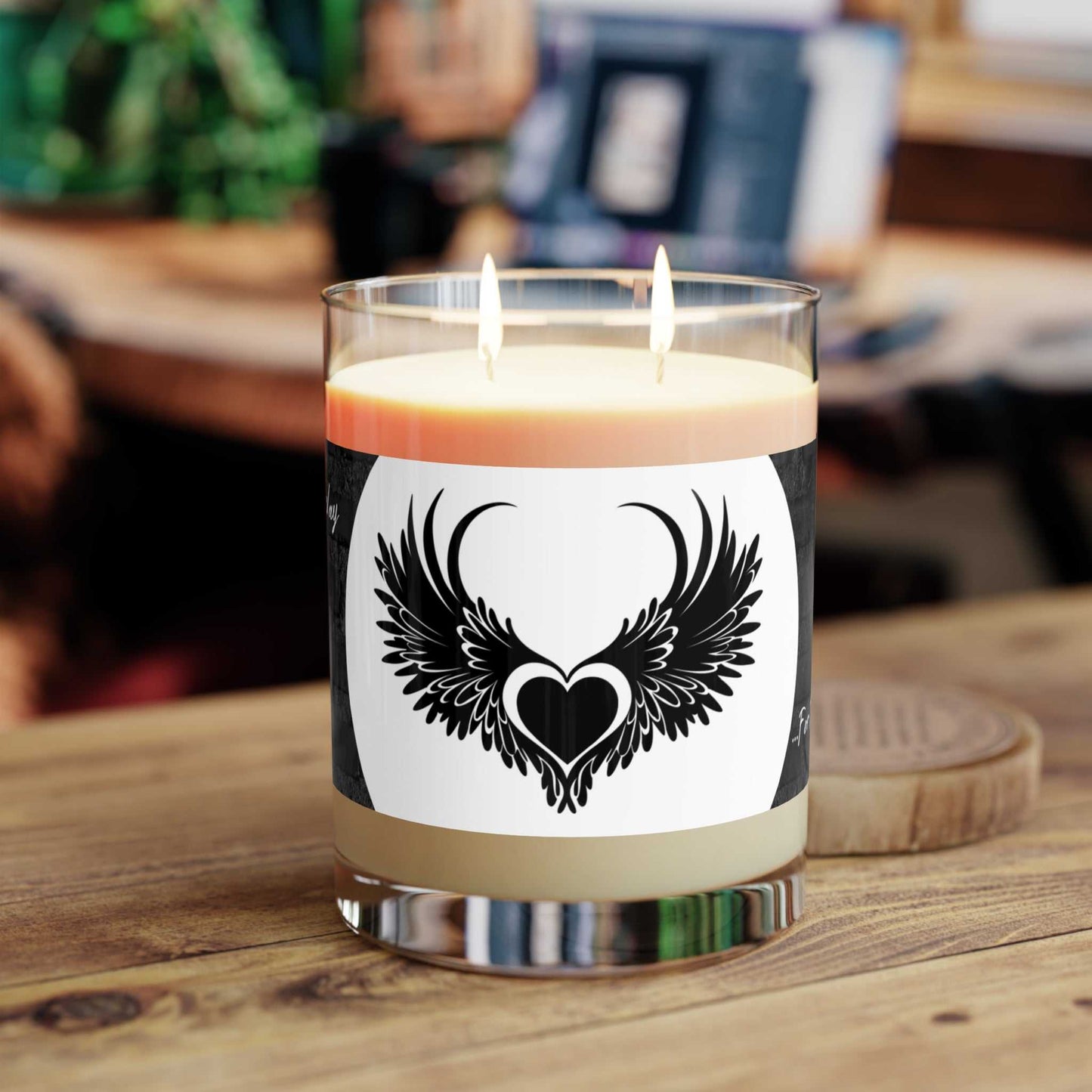 Blackheart Way printed scented candle in matte black jar with logo and flickering flame
