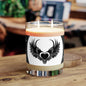 Blackheart Way printed scented candle in matte black jar with logo and flickering flame
