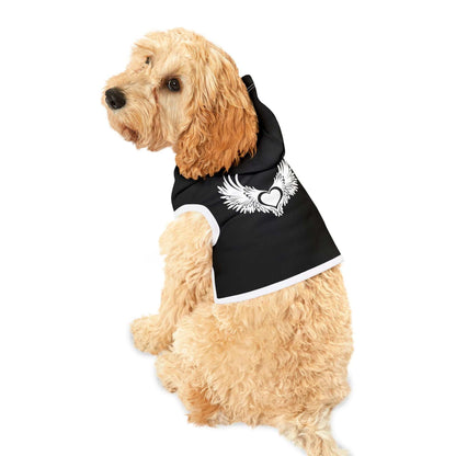Dog wearing a stylish black pet hoodie with a winged heart design, perfect for warmth and fashion during walks.