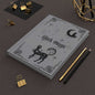 Black Magic Journal with black cats, glowing moon, and stars on matte black cover