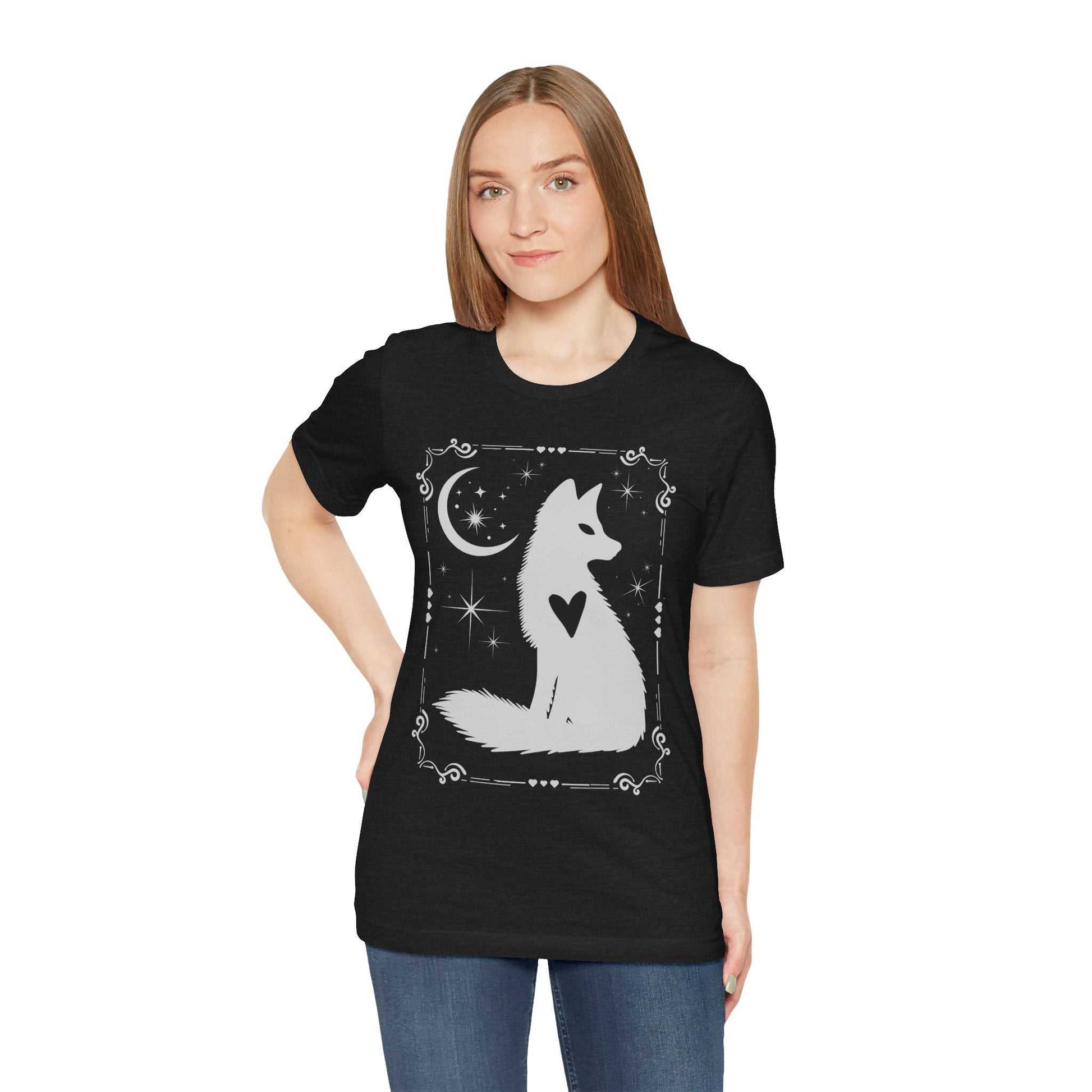Woman wearing black Celestial Fox Tee with white fox and night sky design, short sleeve unisex cotton shirt