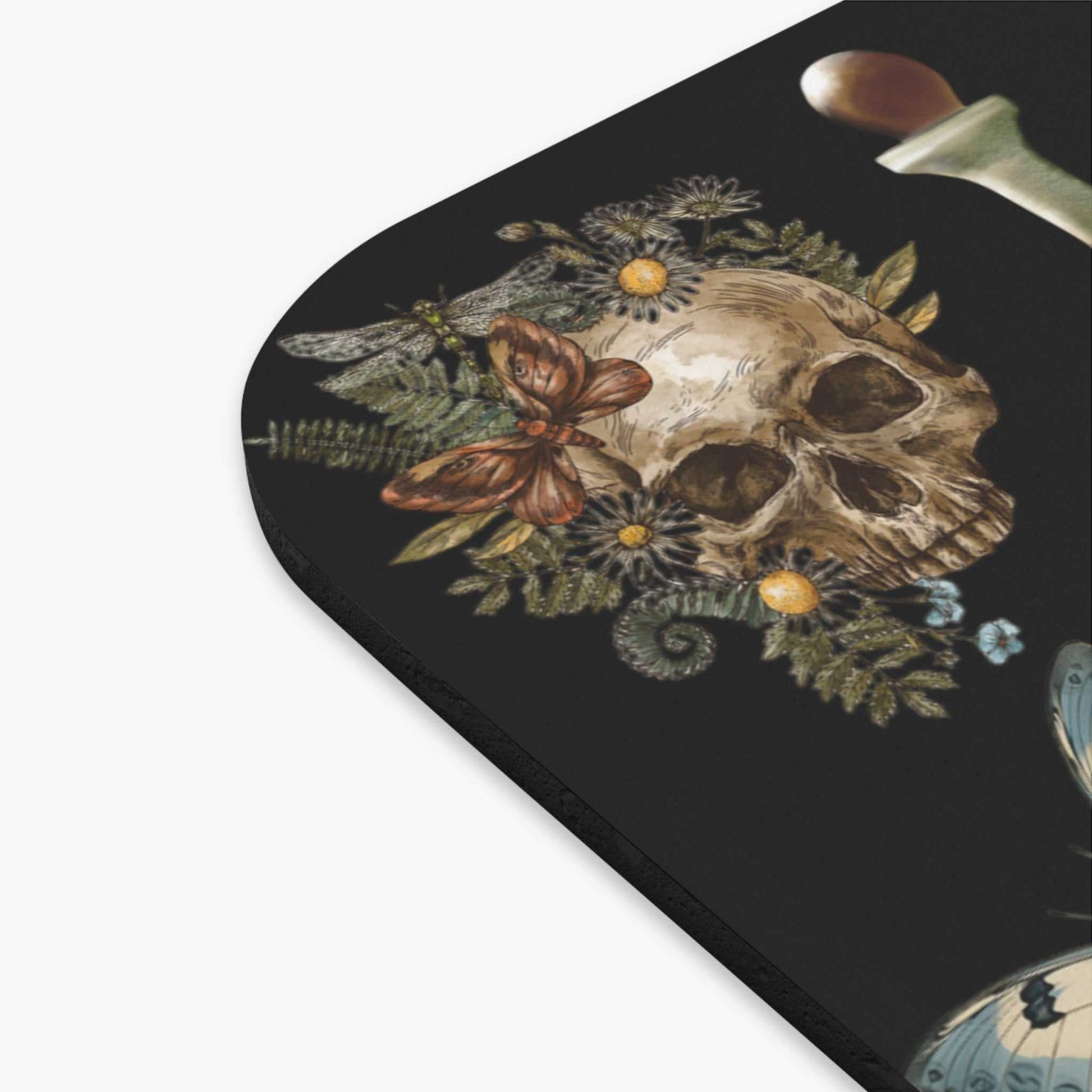 Gothic witchcraft mouse pad with skull and potion design, spooky aesthetics, vibrant decoration.