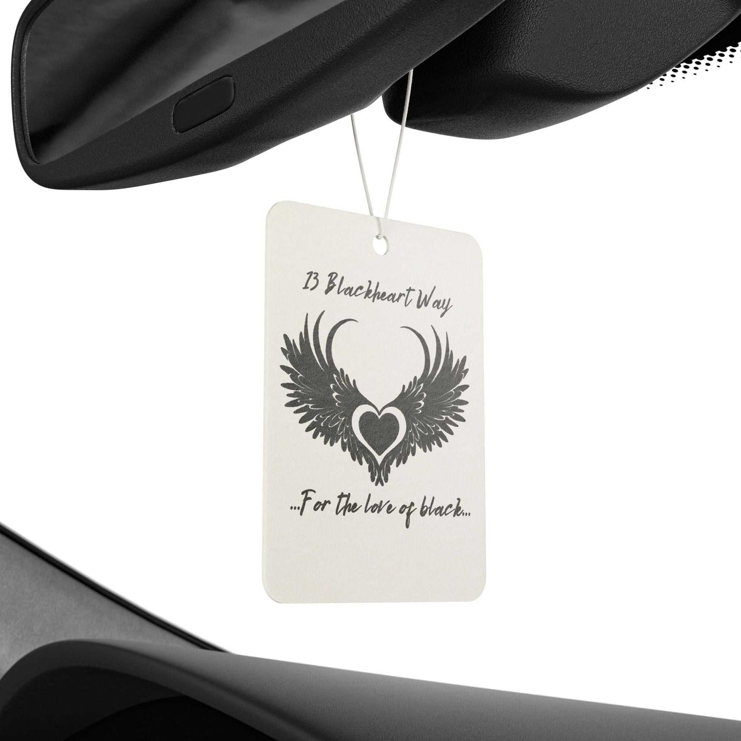 Car air freshener with 13 Blackheart Way logo hanging in vehicle interior.
