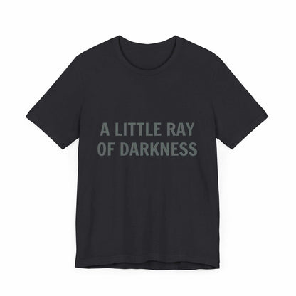 Unisex jersey short sleeve tee with "A Little Ray of Darkness" text, black color.