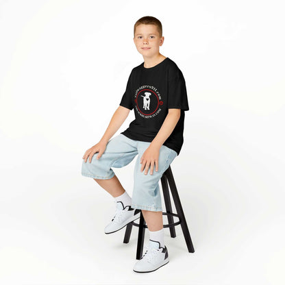 Child wearing Tailwaggers 911 Kids Heavy Cotton Tee black dog rescue shirt sitting on stool