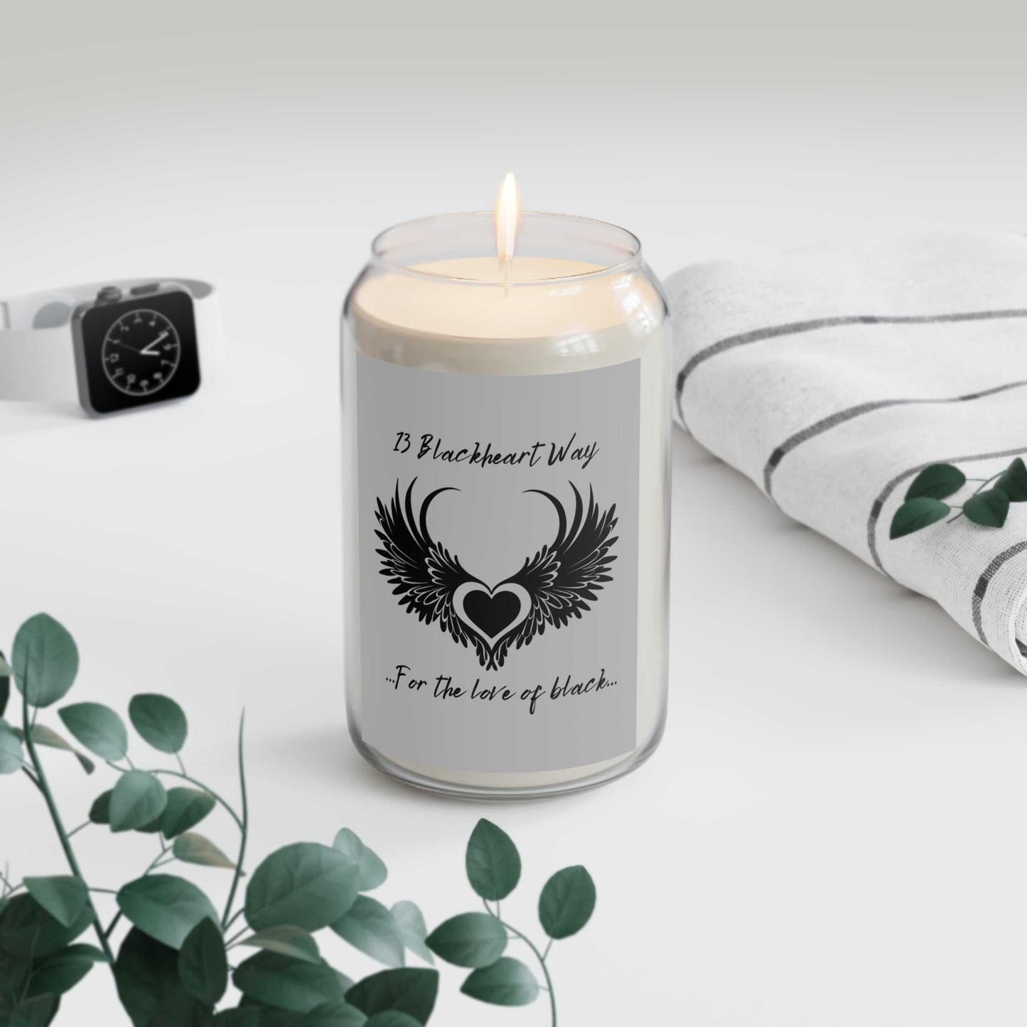 Blackheart Way Scented Candle in glass vessel, lit with calming ambiance; perfect eco-friendly home decor.